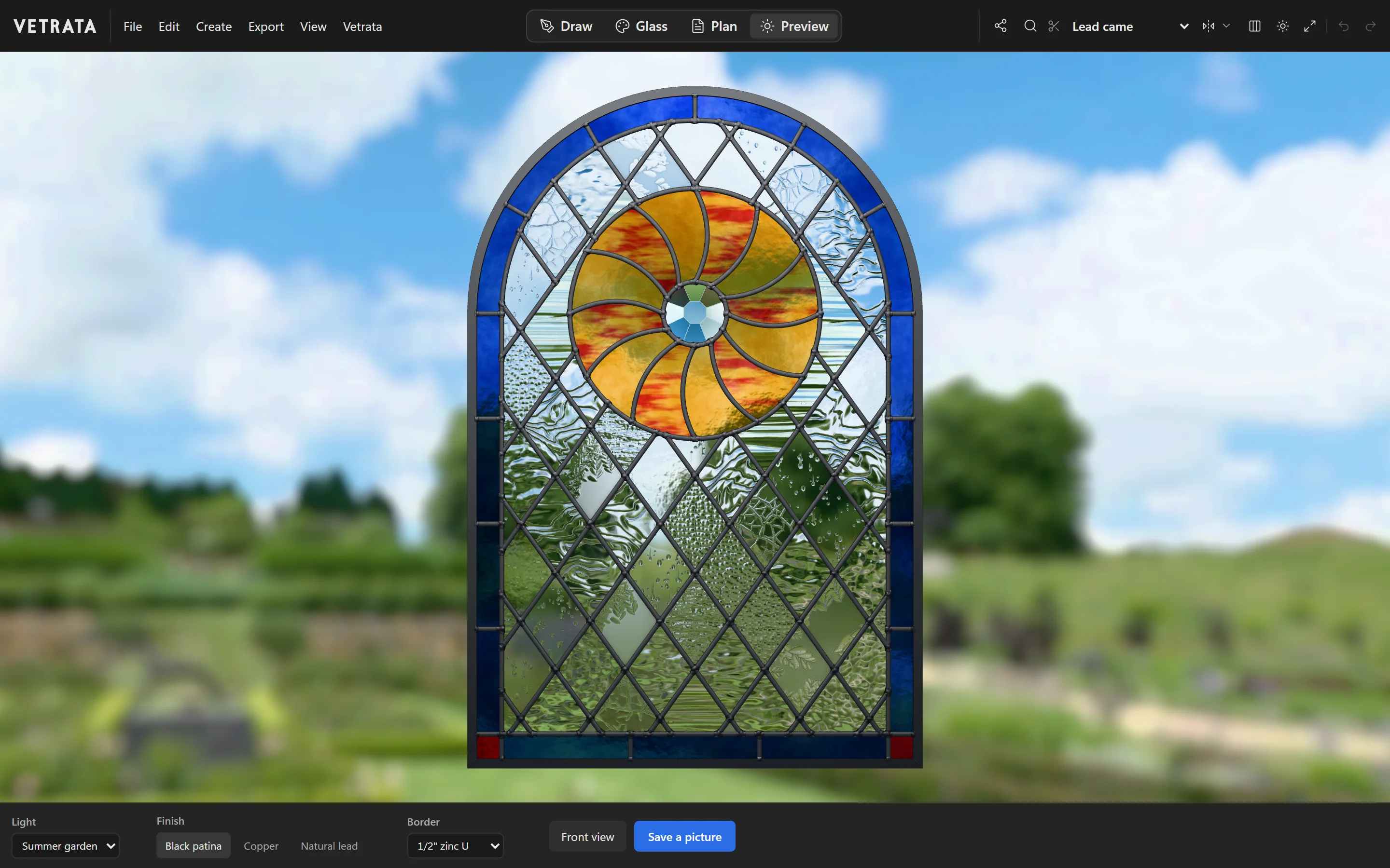 The Studio's Preview: the Sunwheel window in 3D against a summer garden, its light, finish and border chosen under it.